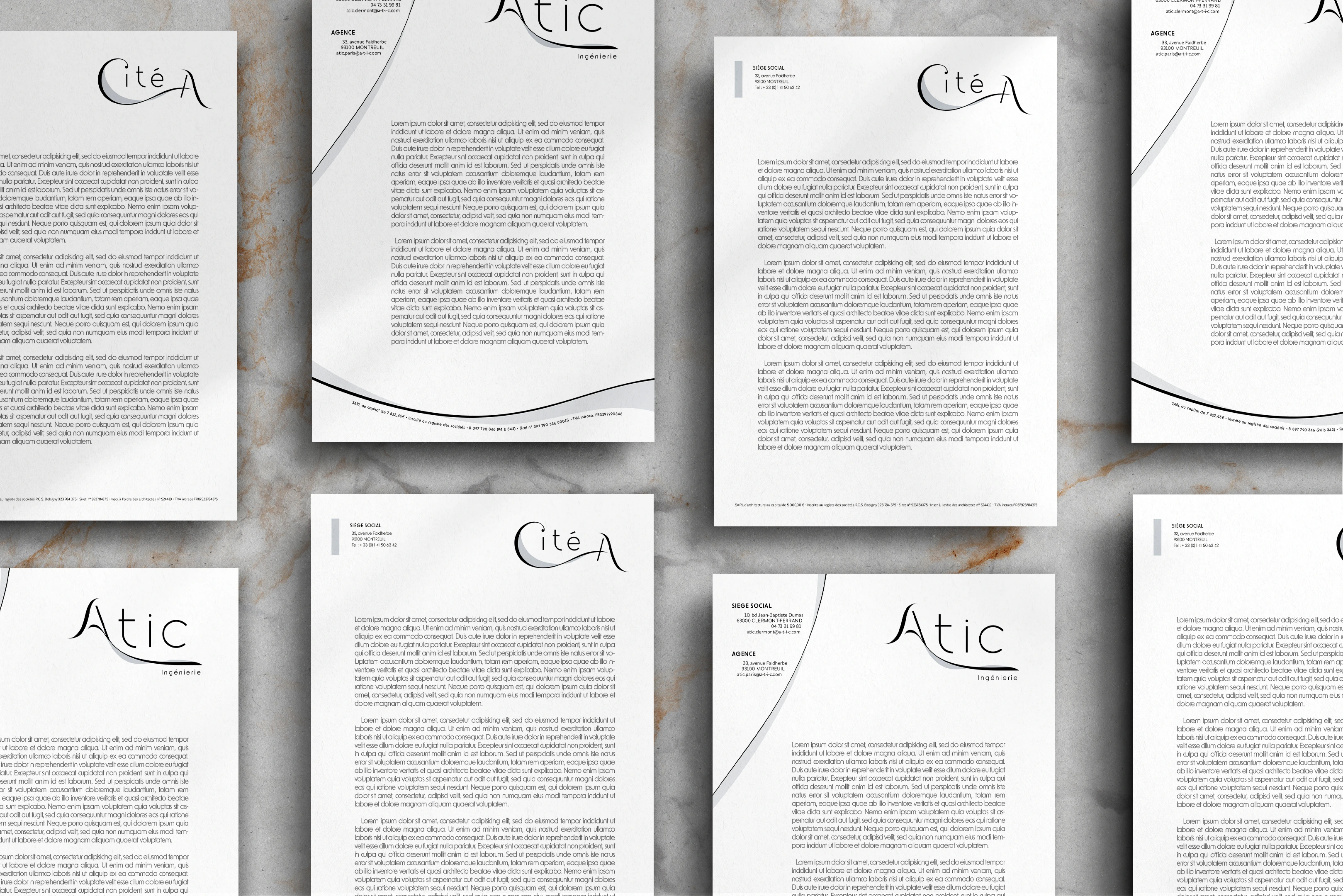 Examples of stationery for Atic and Cité A with their new visual identity, showing letters, envelopes, and notepads.