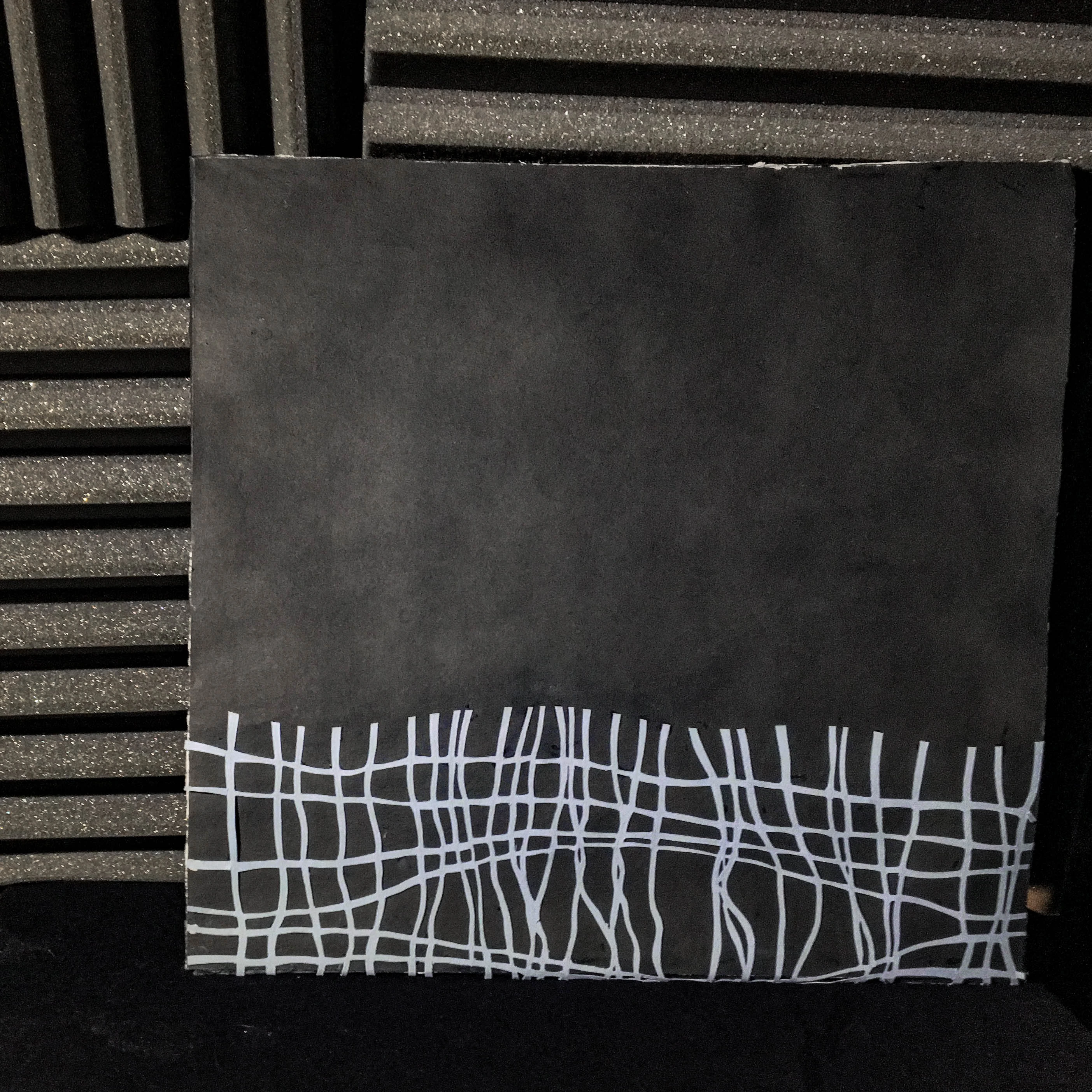 Back view of the vinyl cover with a minimalist woven pattern.